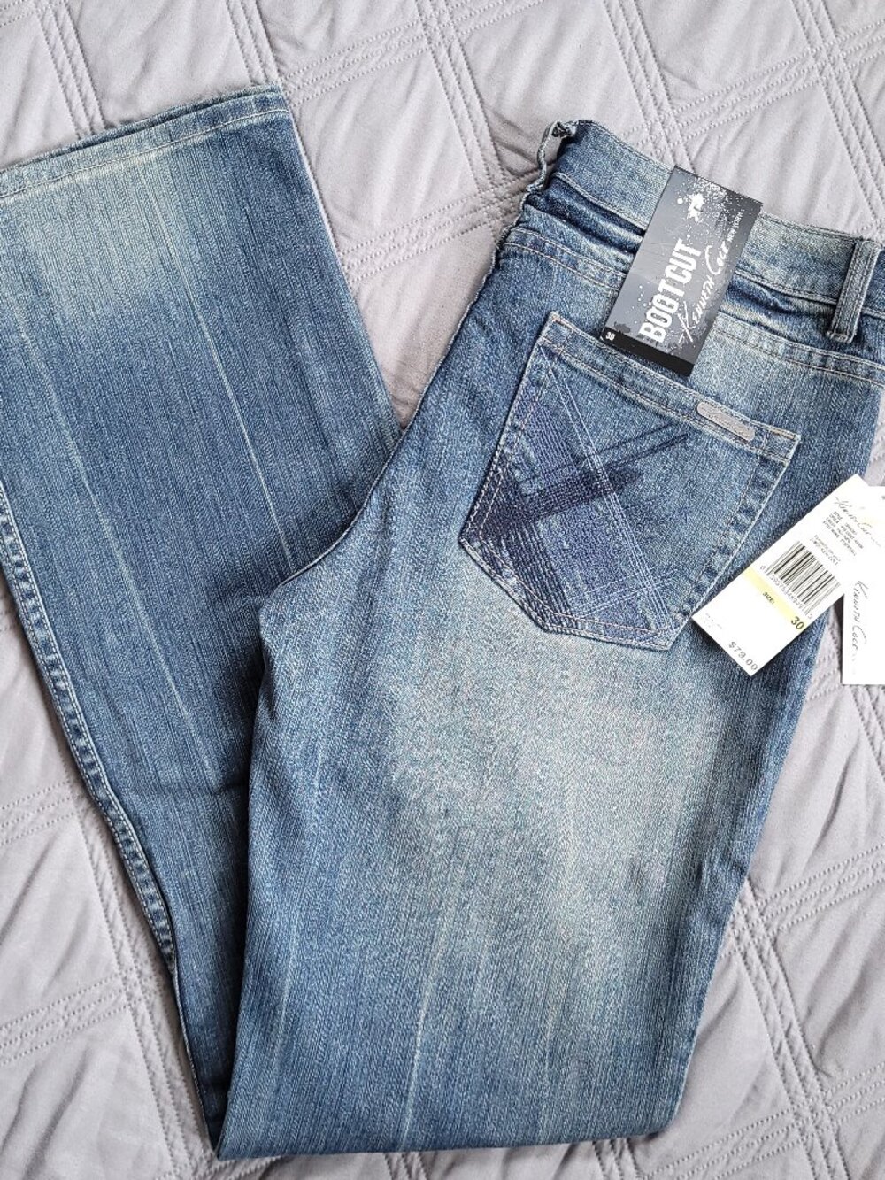 New Kenneth Cole jeans-low rise, stretch, boor cut, light faded rinse jeans.